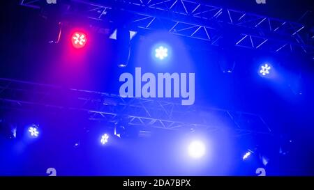 Nightlife, music, entertainment and technology concept. Colorful bright concert lighting equipment for stage at nightclub, illumination of Stock Photo