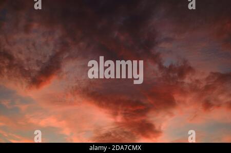 Beautiful multi colored moody sunset view. Full frame cloudy sky background Stock Photo