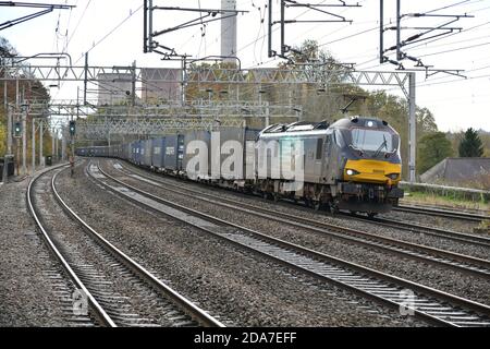 Direct Rail Services Electro-Diesel Class 88 88005 leans into the curves through Rugeley Trent Valley with a fully loaded Tesco Container train Stock Photo