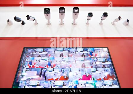 CCTV cameras and monitor on red Stock Photo
