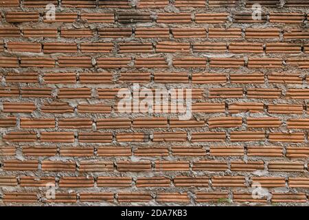 brick walls background and texture. The texture of the brick is orange. Background of empty brick basement wall. Stock Photo