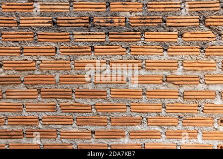 brick walls background and texture. The texture of the brick is orange. Background of empty brick basement wall. Stock Photo