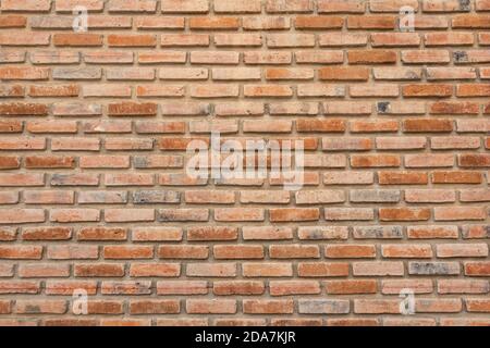 brick walls background and texture. The texture of the brick is orange. Background of empty brick basement wall. Stock Photo