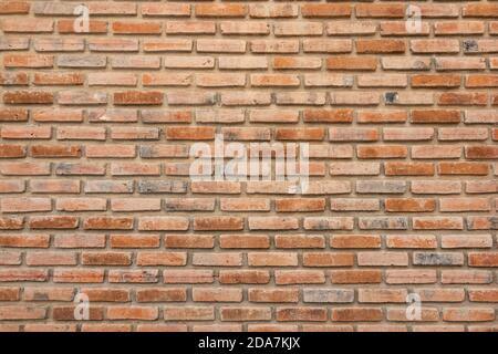 brick walls background and texture. The texture of the brick is orange. Background of empty brick basement wall. Stock Photo