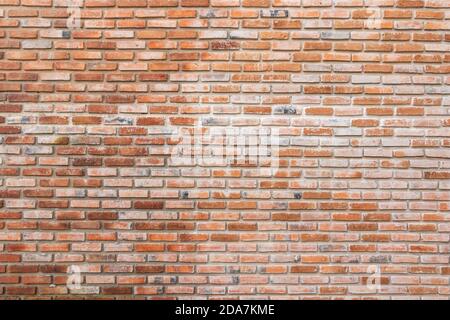 brick walls background and texture. The texture of the brick is orange. Background of empty brick basement wall. Stock Photo