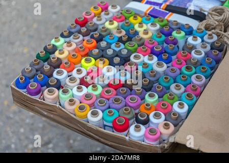 Big Box of Colourful Sewing Thread Reels Stock Photo