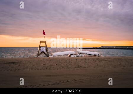 Morning moment is captured at one of the Chicago’s beach located on the Lake Shore drive. Clouds at the beach add more vibrant color in the sky makes Stock Photo