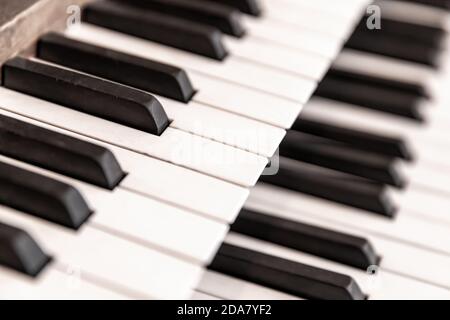 Double layer of keys on a traditional church pipe organ. Retro style with shallow depth of field. Stock Photo