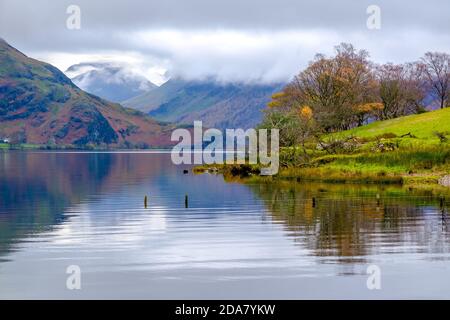 Crummock Water in the north western Lake District National Park, Cumbria. The fells around Buttermere in distance Stock Photo