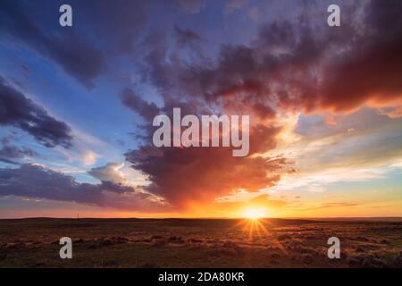 Colorful sunset sky and scenic landscape in the Thunder Basin National Grassland, Wyoming, USA Stock Photo