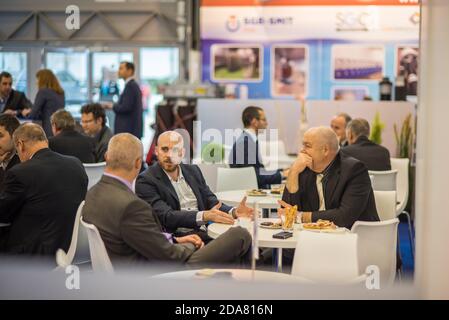 Colleagues having a drink attending the Amper event at the convention trade center in Brno. BVV Brno Exhibition center. Czech Republic Stock Photo