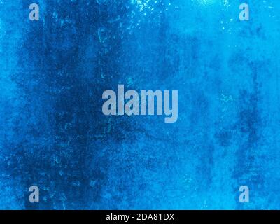 Cement Wall With Neon Light on Dark Background. Reflection of Neon Lights Stock Photo