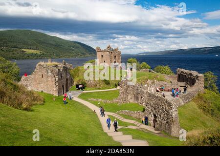 Tourists visit ruins of Urquhart Castle along the shores of Loch Ness, Highlands, Scotland Stock Photo
