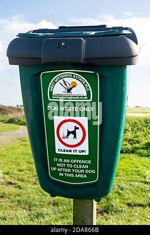 Bin for dog waste in the countryside at West Wittering, West Sussex, England, UK Stock Photo