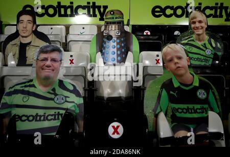 A cardboard cut-out of a Dalek and fans in the stands before the Papa John's Trophy Southern Group E match at The New Lawn, Nailsworth. Stock Photo