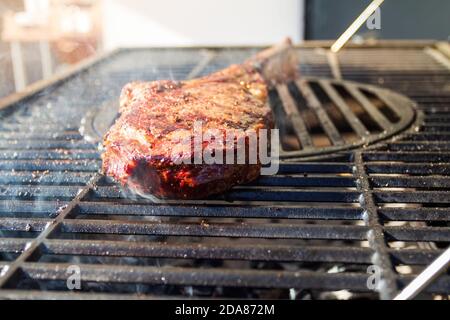Dry Aged Barbecue Tomahawk Steak on grill Stock Photo