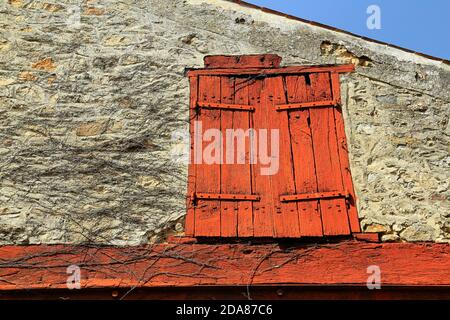 Old, weathered, painted, wooden window shutters. Stock Photo