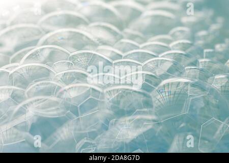 Pile of light blue  soap bubbles with a gradient from white to light blue, use as background or tutorial to wash your hands . Stock Photo
