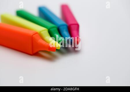 Highlighters in blue, red, yellow, neon, pink and green fanned out as a fan, opened textmarker looking onto the  pen tip, Highlighters are very suitab Stock Photo
