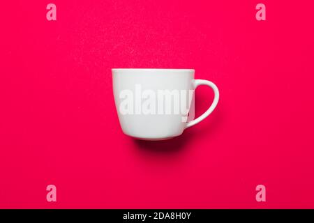 One white coffee mug on a pink uniform background with soft light and shadows, use as virtual background for zoom meetings Stock Photo