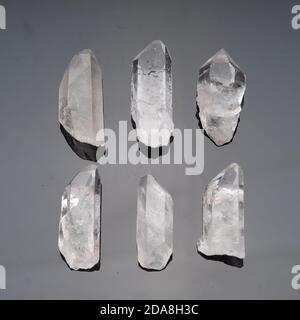 Crystals of natural quartz on a gray background Stock Photo