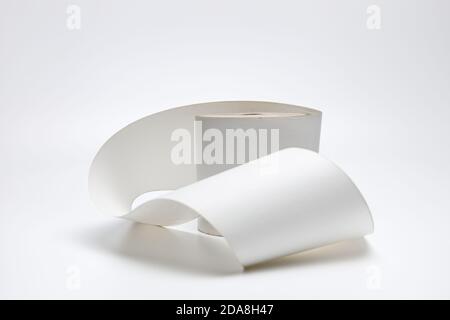 A single roll of  thermal paper for printing receipts on a white uniform background, it is used in cash registers and receipt printers and pollutes th Stock Photo