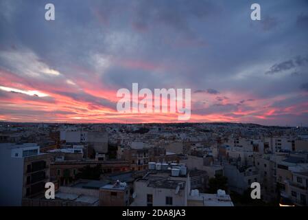Interesting colours in the sky at dusk in Valletta, Malta Stock Photo