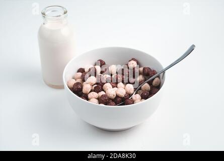 Healthy Breakfast of wheat balls and fresh milk on a light background. Stock Photo