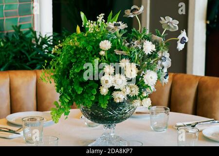 elegant dining table set with flower bouquet Stock Photo