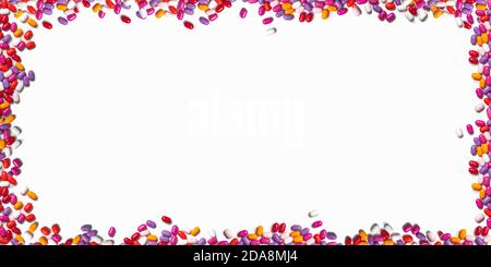 round frame of multicolored pills on a white background. colored pills on a white background. banner Stock Photo