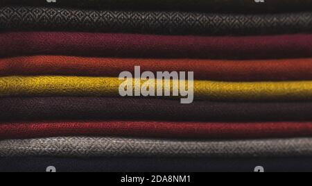 close up of colorful fabric,  a pile of cashmere textile, stack of colorful clothes, pile of clothes Stock Photo