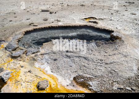 Ear Spring in the Upper Geyser Basin is named for its shape. It often ...