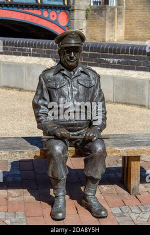 The statue of actor Arthur Lowe playing Captain Mainwaring in the British sitcom Dad's Army, Thetford Riverside, Thetford, Norfolk, UK. Stock Photo