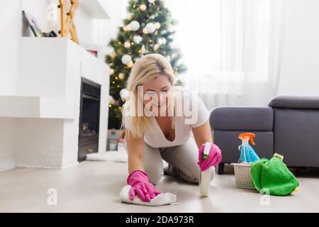 Young family cleaning apartment after christmas party Stock Photo