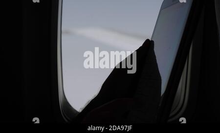 Using tablet computer on a flight. Stock Photo