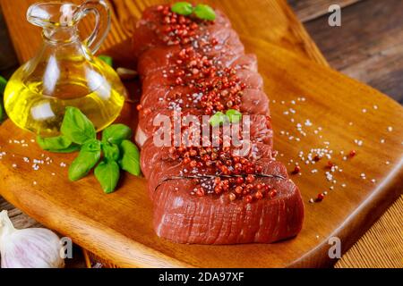Ingredients for grilling- tasty beef meat. Raw beef tenderloin. Stock Photo