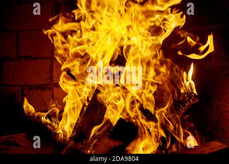 Flames firewood burning fire, in the fireplace Stock Photo