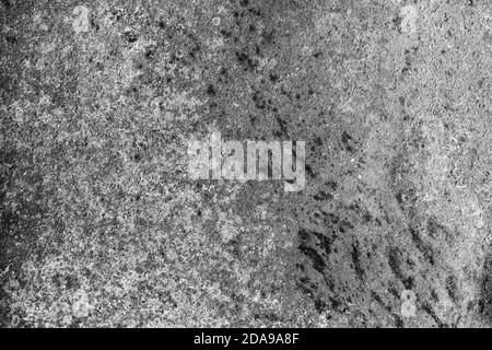An abstraction of rusty old gray and black metal, covered with various scratches and corrosion Stock Photo