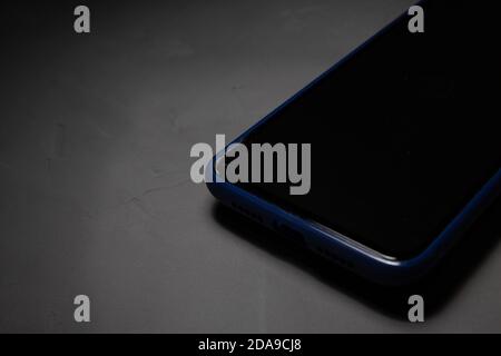 Cracked smartphone screen. Broken glass on phones display. The smartphone falls to the floor and the screen crashed. Stock Photo