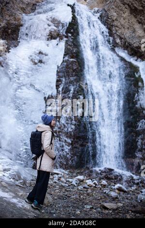 Hiking to the frozen waterfall at Issyk Ata in Kyrgyzstan's Chuy Oblast. Stock Photo