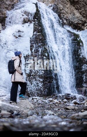 Hiking to the frozen waterfall at Issyk Ata in Kyrgyzstan's Chuy Oblast. Stock Photo