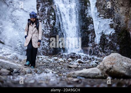 Hiking to the frozen waterfall at Issyk Ata in Kyrgyzstan's Chuy Oblast. Stock Photo