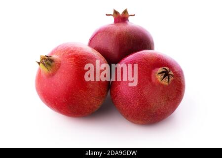 Ripe pomegranate fruits isolated on white background Stock Photo