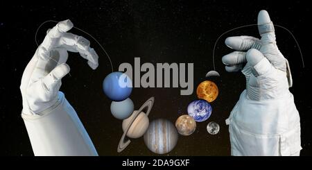 Necklace of planets in hands. Elements of this image furnished by NASA. Stock Photo