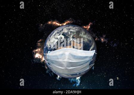 Planet Earth is sick with a virus. Medical mask on the earth. Elements of this image furnished by NASA. Stock Photo