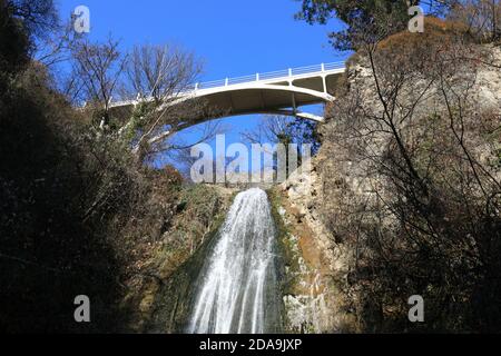 Bridge over waterfall in botanical garden of Tbilisi Stock Photo