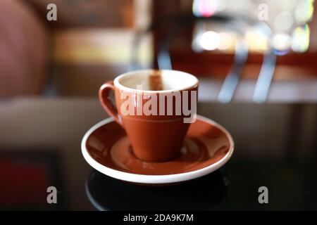 Empty cup of coffee on table in cafe Stock Photo