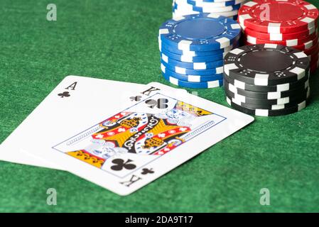 Poker chips, cards and game dice in a casino Stock Photo
