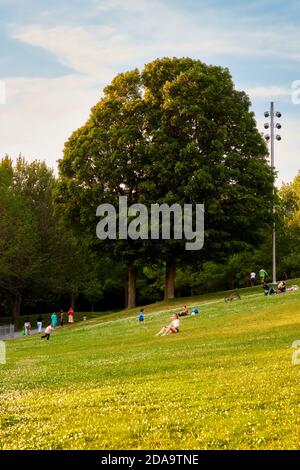 Montreal, Canada - June, 2018: People are having fun and relaxing in Mount Royal park in Montreal, Canada on a sunny summer afternoon. Stock Photo