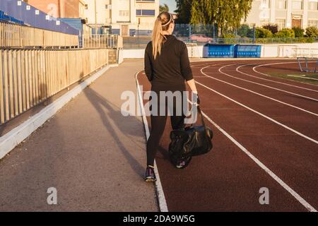 Fitness woman in black tracksuit 